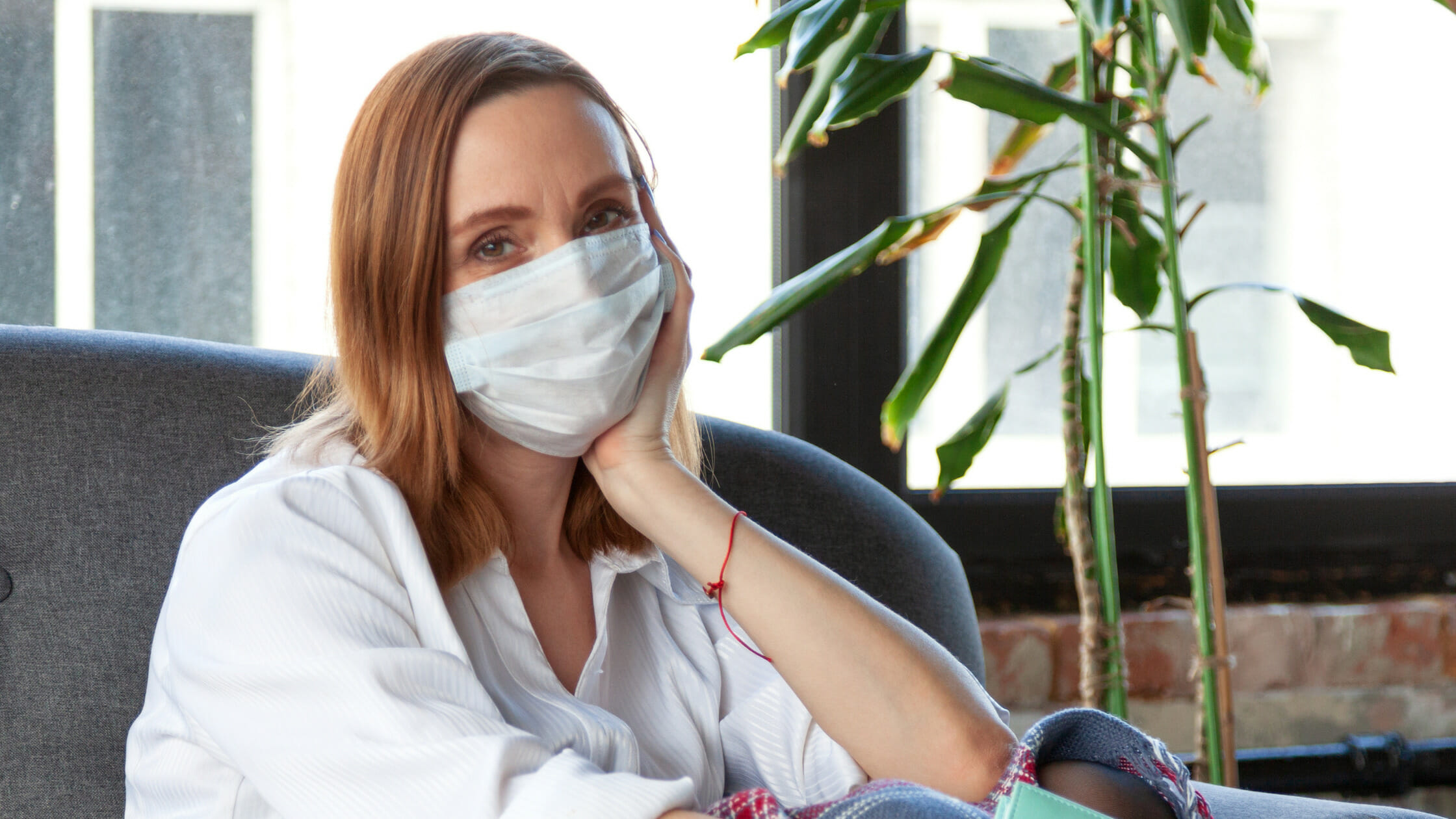 woman struggling with boredom while quarantined